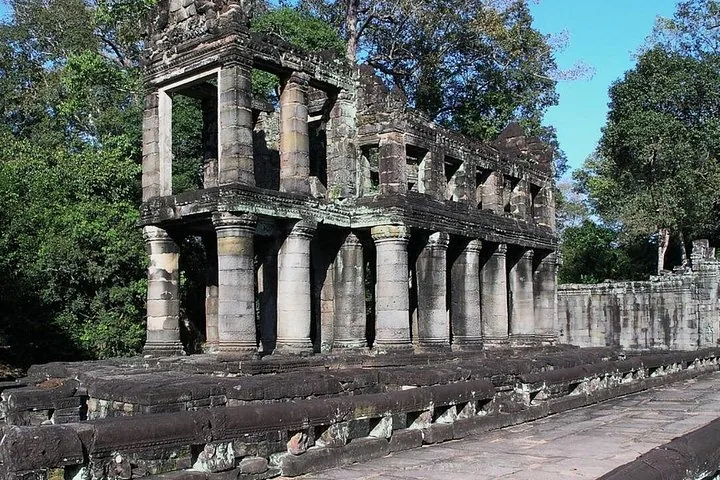 Two-story stone structure with round columns at the Preah Khan temple.